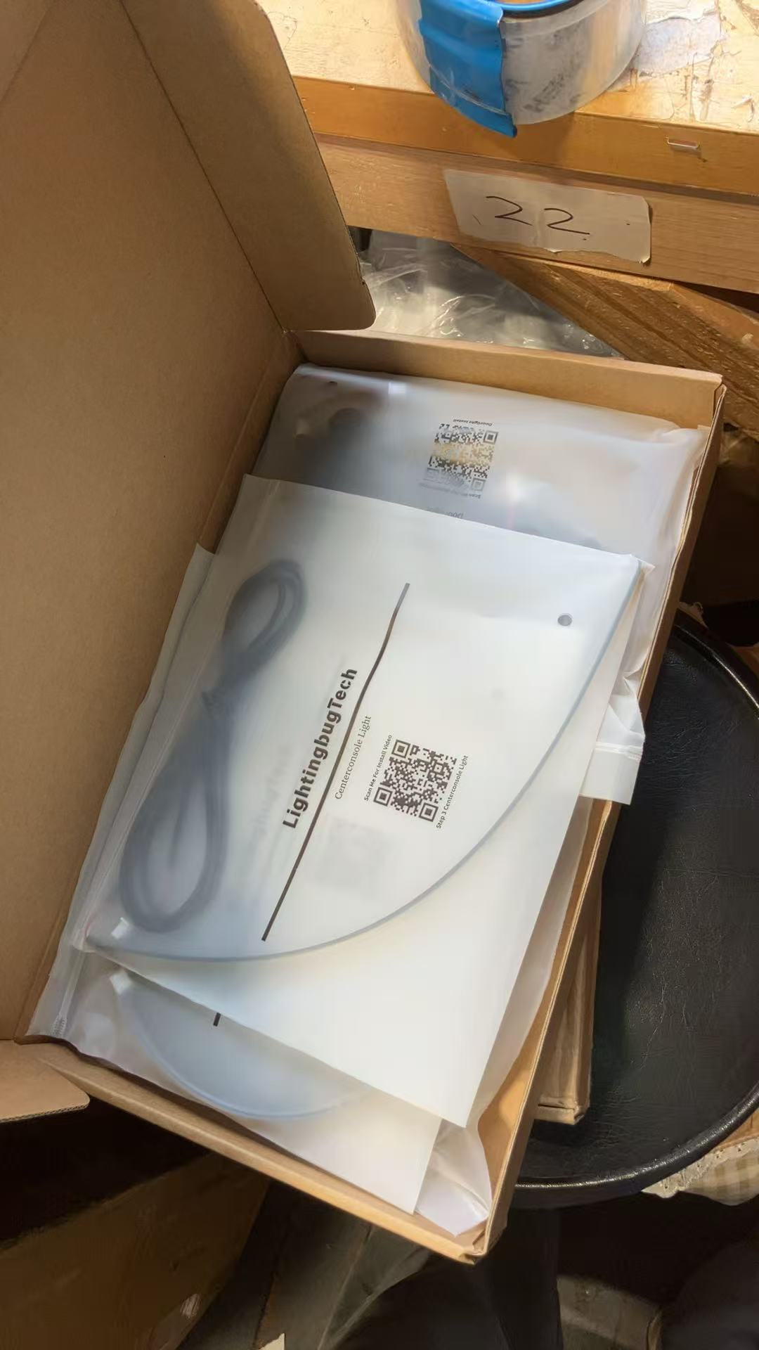 Tesla Ambient Lighting Kit from LightingBugTech in a box, featuring packaging and cables