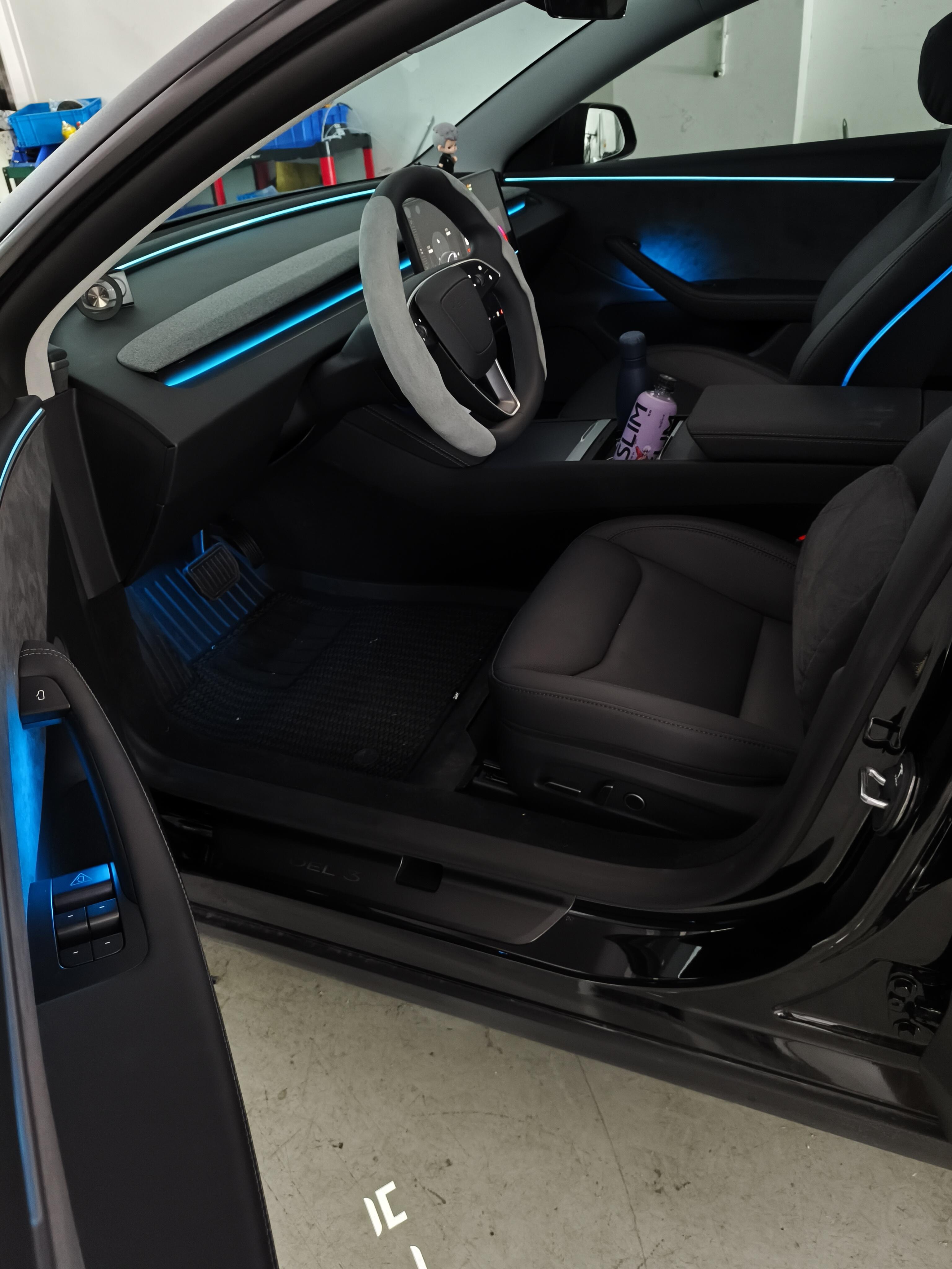 Tesla Highland & Juniper Ambient Lighting Kit installed in a sleek black Tesla interior