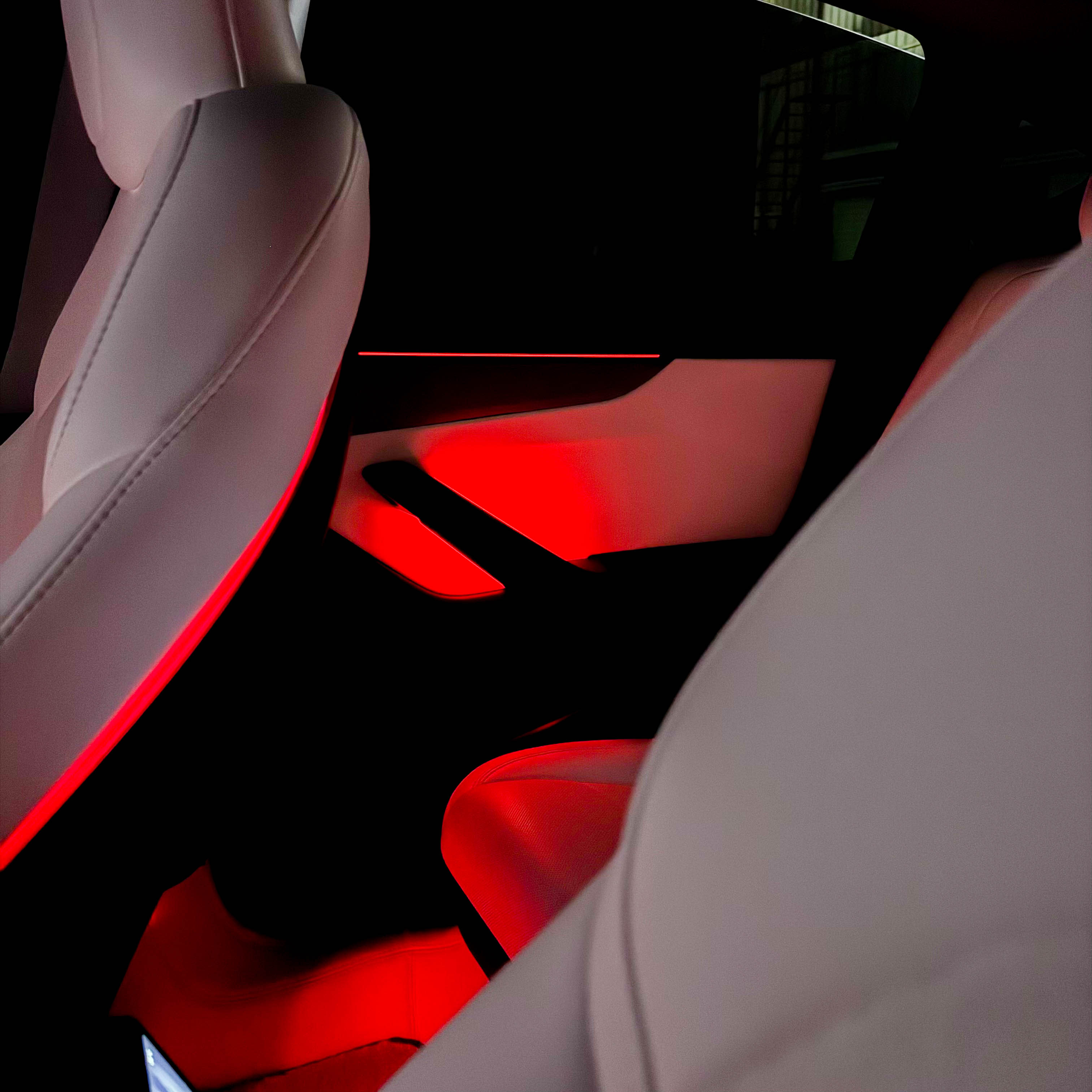 Tesla Highland & Juniper Ambient Lighting Kit illuminating the interior with red glow in a Tesla vehicle