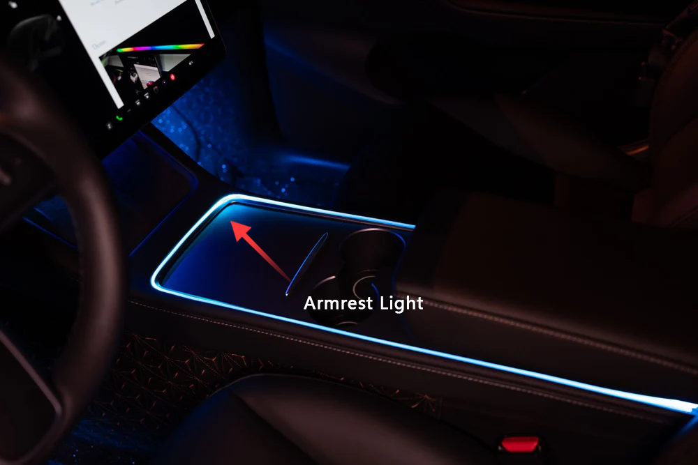 Tesla Model 3 Model Y ambient lighting kit glowing blue around center console armrest in car interior
