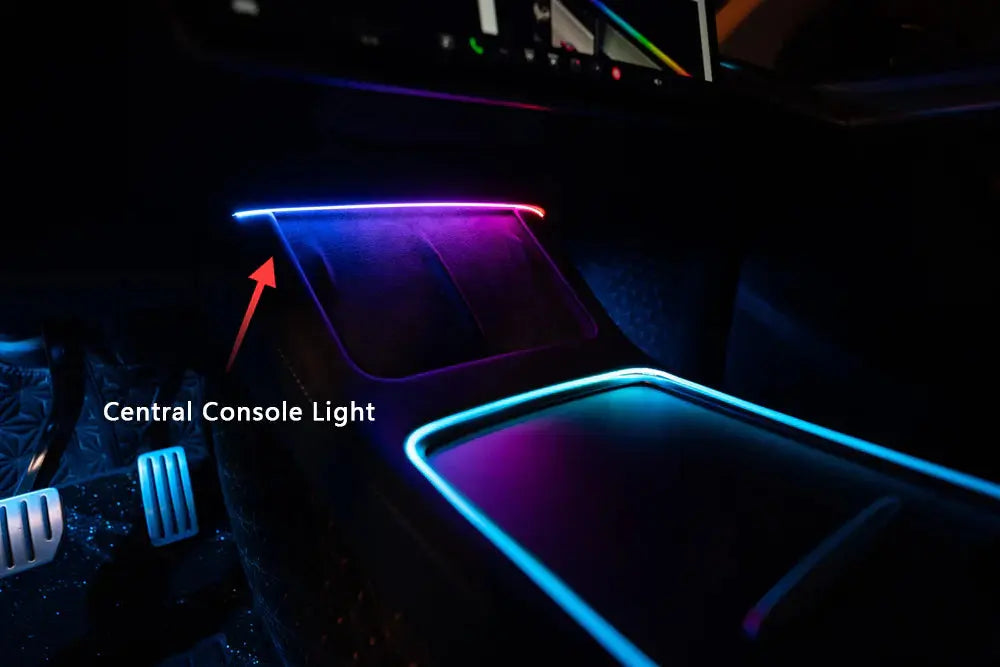 Tesla Model 3 Model Y ambient lighting kit glowing inside vehicle central console with blue and purple LED lights