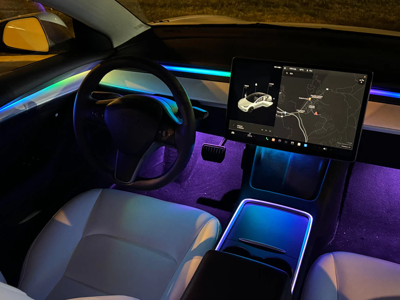 Tesla Model 3 interior featuring LightingBugTech Tesla Model 3 Model Y ambient lighting kit with colorful LED accents