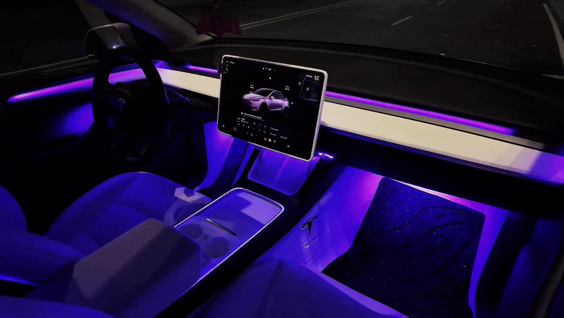 Tesla Model 3 Model Y ambient lighting kit glowing purple inside car interior by LightingBugTech