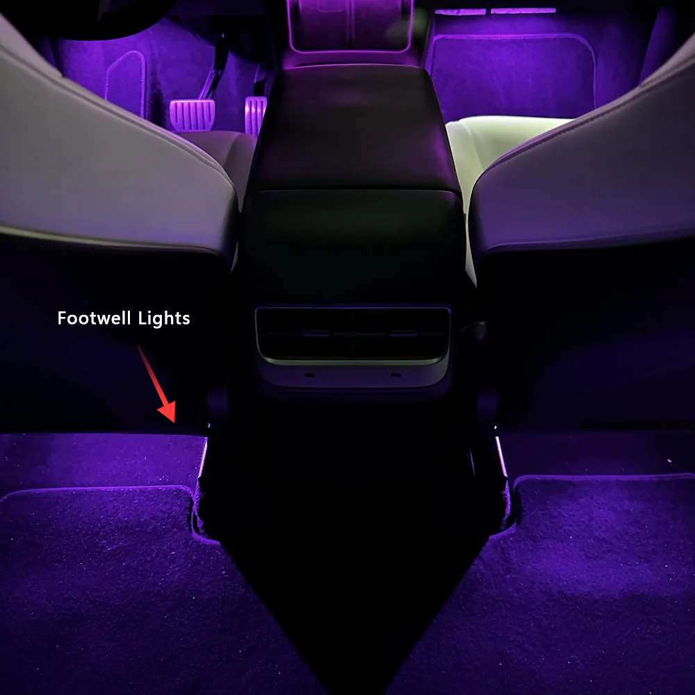 Tesla Model 3 Model Y ambient lighting kit showing purple footwell lights in car interior by Lighting Bug