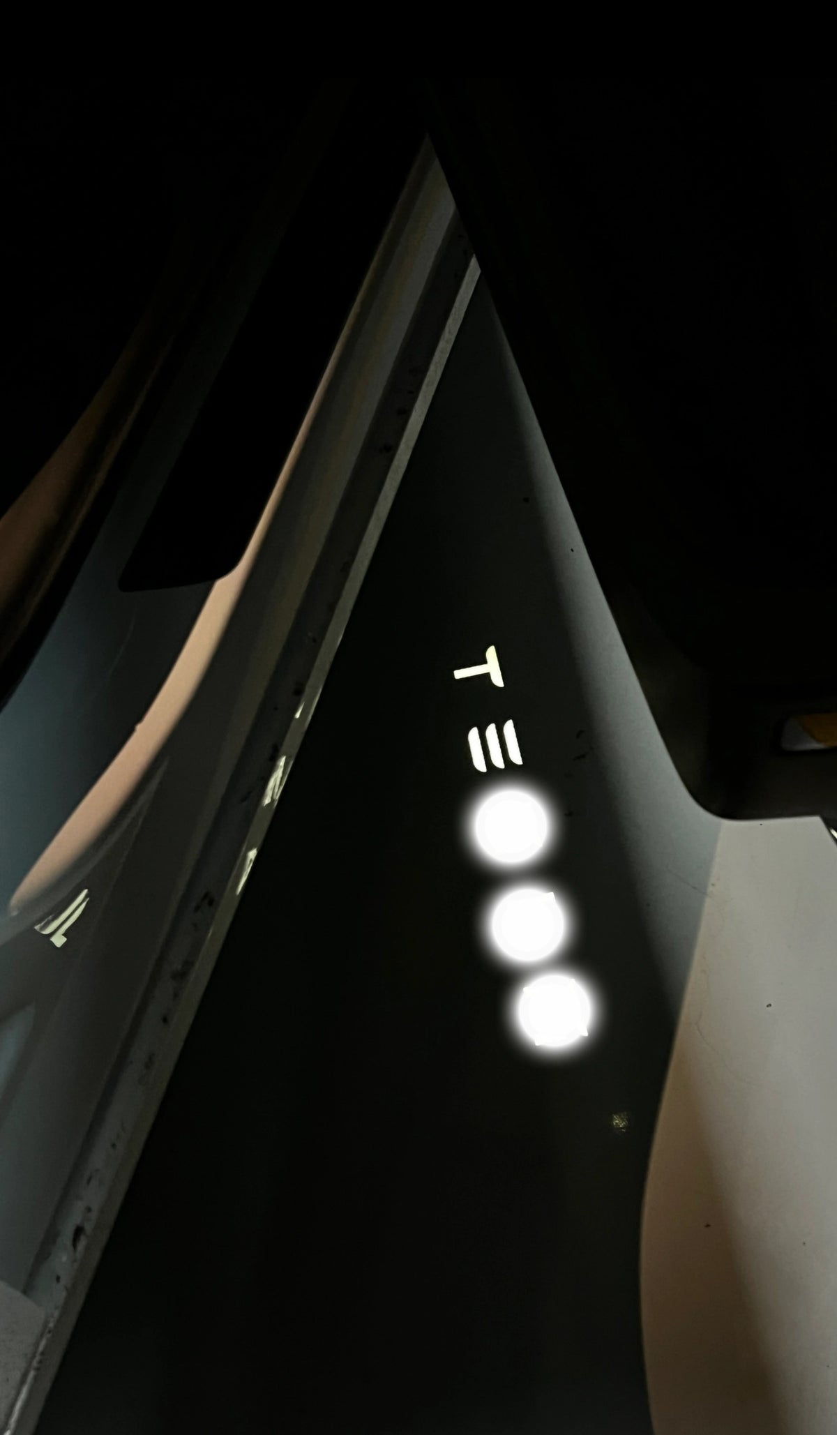 LightingBugTech LED panel with three round lights and touch sensor icons on a dark reflective surface