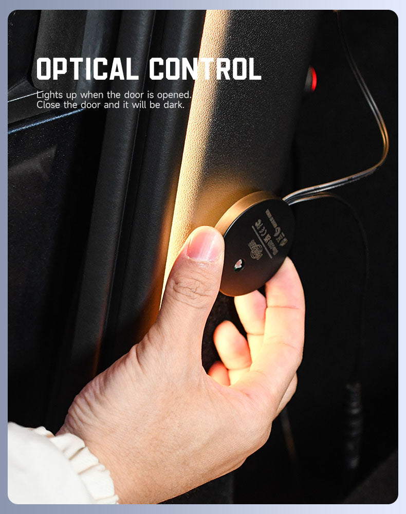 Hand installing optical control sensor for plug and play Tesla trunk light strip with wiring visible